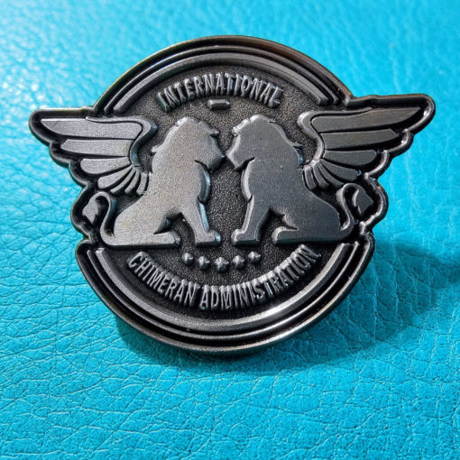 Pewter pin of the ICA logo with winged lions